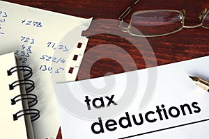 Tax deductions written on a paper.