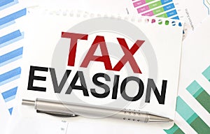 TAX EVASION on paper sheet on charts