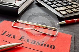Tax evasion result of audit with clipboard. photo