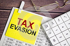 tax evasion Text on business paper on office table