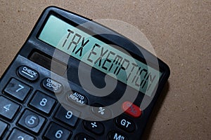 Tax Exemption write on calculator isolated on white board background photo