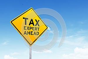 Tax expert road sign shot over beautiful blue sky.