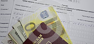 Tax form and passport with money