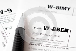 Tax forms and black pencil