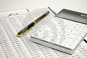 Tax forms, spread sheet with pen and calculator