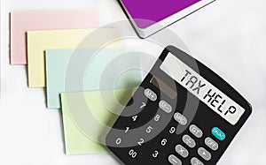 Tax help. On display of calculator is written tax help