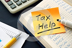 Tax help memo and financial calculations with calculator.