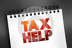 Tax Help text on notepad, business concept background