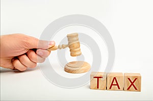 Tax law concept with a gavel. tax court judgments. judge`s hand and the inscription