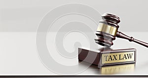 Tax Law: Judge's Gavel as a symbol of legal system and wooden stand with text word