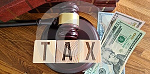 Tax law tax with gavel and money on table