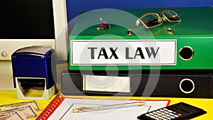 Tax law-text inscription on the folder of the office Registrar photo