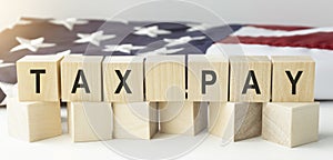 TAX PAY word made with wood building