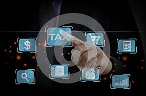 Tax payment  concept. Businessman touching tax  financial virtual button.payment by corporations such as VAT, income tax