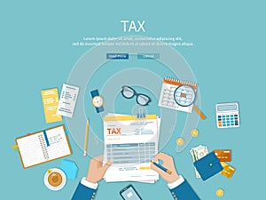 Tax payment. Man fills the tax form and counts. Financial calendar, money, invoices, bills on the table.