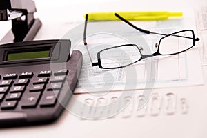 Tax preparation supplies, reading glasses and tax forms