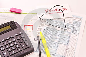 Tax preparation supplies, reading glasses and tax forms