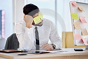 Tax, problem and business man with sticky note in office for debt, audit or financial crisis on computer. Stress, tired