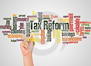 Tax reform word cloud and hand with marker concept