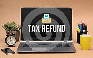 Tax Refund Icon on Office Laptop Screen
