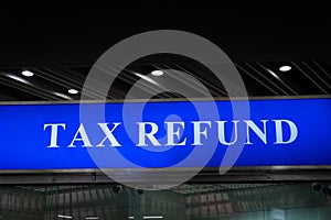 Tax refund sign board at airport
