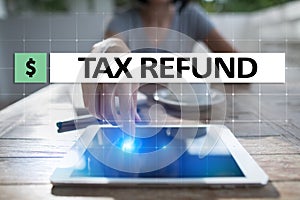 Tax refund text on virtual screen. Business and Finance concept.