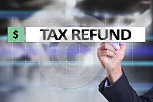 Tax refund text on virtual screen. Business and Finance concept.