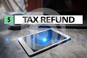 Tax refund text on virtual screen. Business and Finance concept.