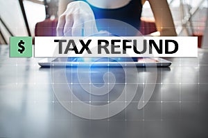 Tax refund text on virtual screen. Business and Finance concept.