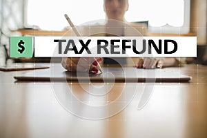 Tax refund text on virtual screen. Business and Finance concept.