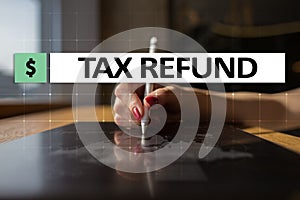 Tax refund text on virtual screen. Business and Finance concept.