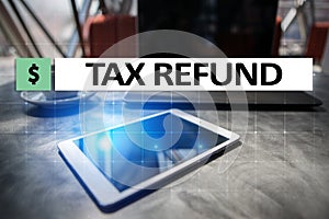 Tax refund text on virtual screen. Business and Finance concept.