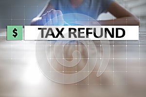 Tax refund text on virtual screen. Business and Finance concept.