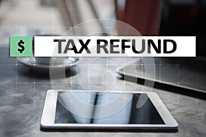 Tax refund text on virtual screen. Business and Finance concept.