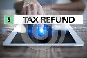 Tax refund text on virtual screen. Business and Finance concept.