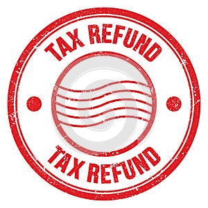 TAX REFUND text written on red round postal stamp sign