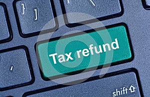 Tax refund words on computer keyboard