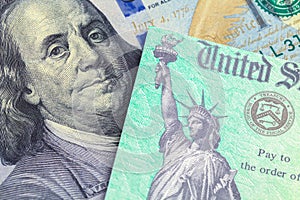 Tax Return Check and Hundred Dollar Bill photo