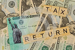 Text write TAX RETURN on stimulus economic tax return check of American Internal Revenue Service individual income tax at U.S. photo