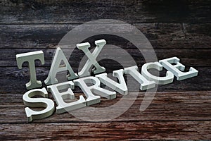 Tax Service Word alphabet letters on wooden background