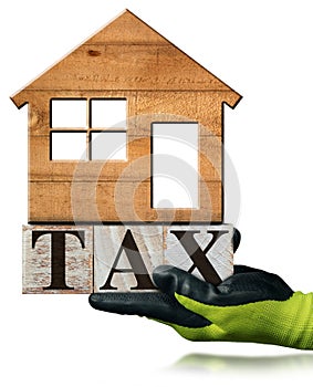 Tax Text made of Wooden Blocks and Small Wooden Model House