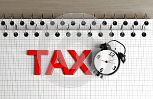 Tax Text Note Pad And Clock Focused Image