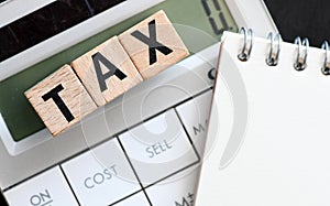 TAX text on wooden cubes. Tax Business Concept