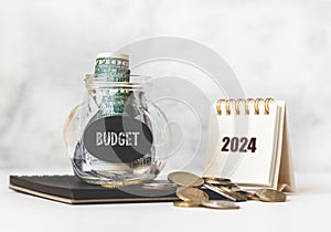 Tax time in 2024. Glass money box with money