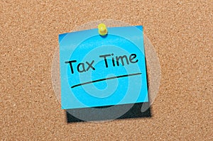 Tax Time Concept On office corkboard. Notification of the need to file tax returns, tax form