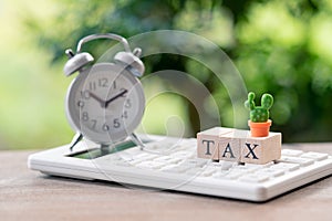 TAX Time Pay Annual income TAX for the year on calculator. usi