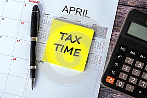 Tax Time text on adhesive note