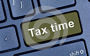 Tax time words on keyboard