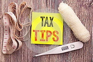 Tax Tips. Business fitness health concept for Taxpayer Assistance Refund Reimbursement written sticky note empty paper background