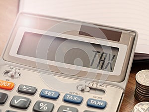 Tax word on calculator. Business and finance tax concept for yearly tax time